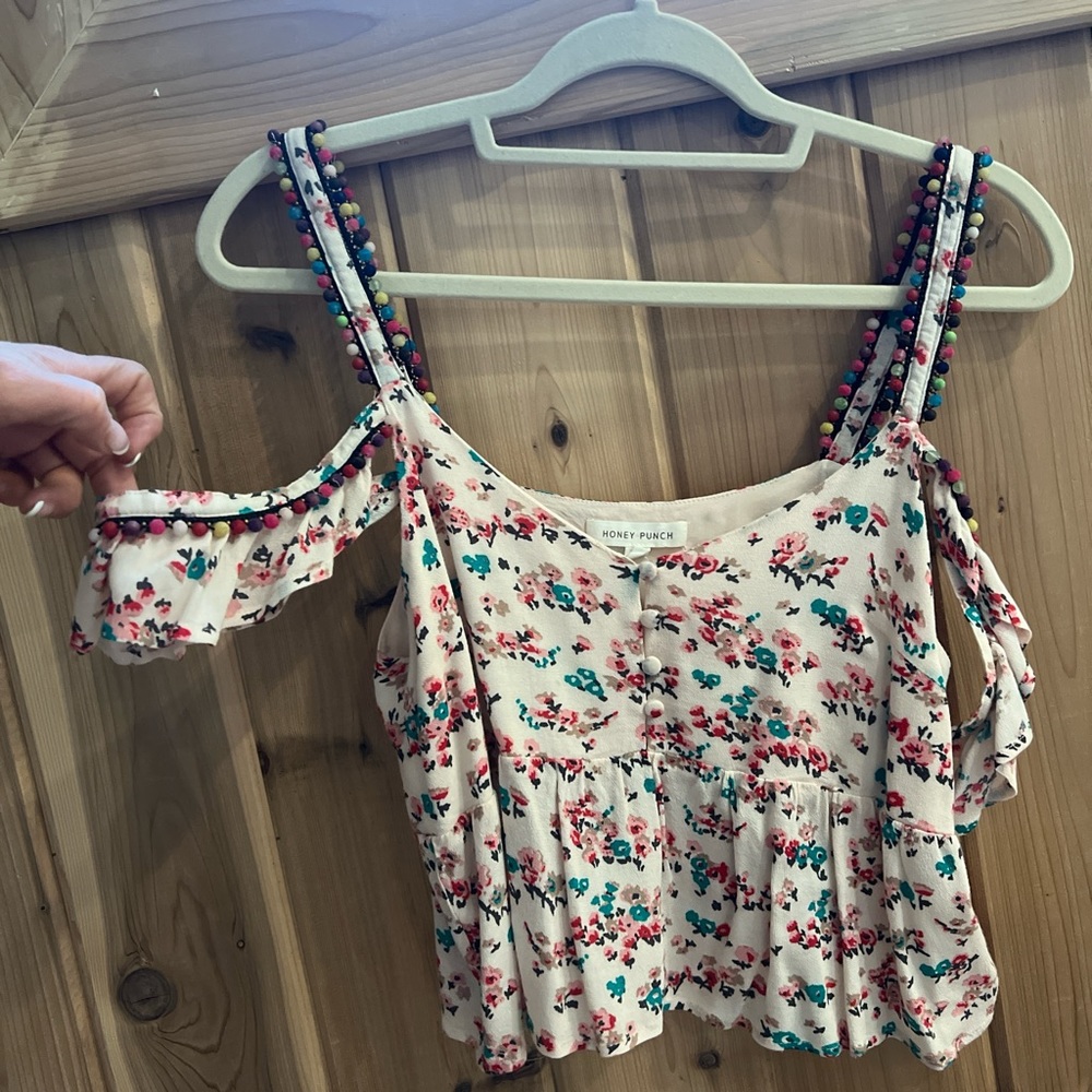 Beautiful floral, baby dollblouse front button details and pom-poms on the strap